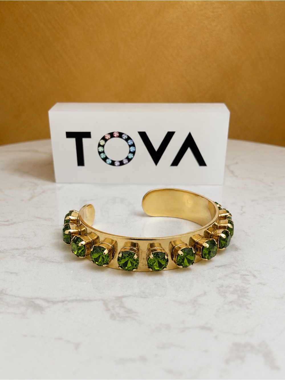 TOVA NYON Gold Cuff Bracelet with 
Deep olive stones